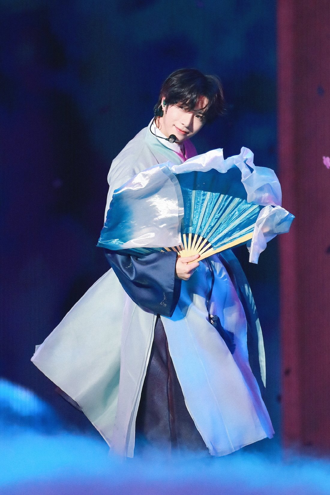 TXT members performing energetic choreography on stage