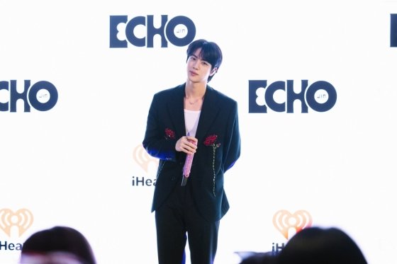 Empire State Building in 'Echo' album colors: blue, pink, yellow, white