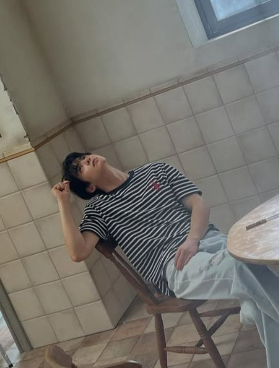Cha Eun-woo poses for a fashion brand photoshoot, displaying his signature dreamy visuals.