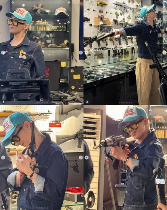 G-Dragon flaunts gun tattoo at a gun shop. Photo: G-Dragon SNS