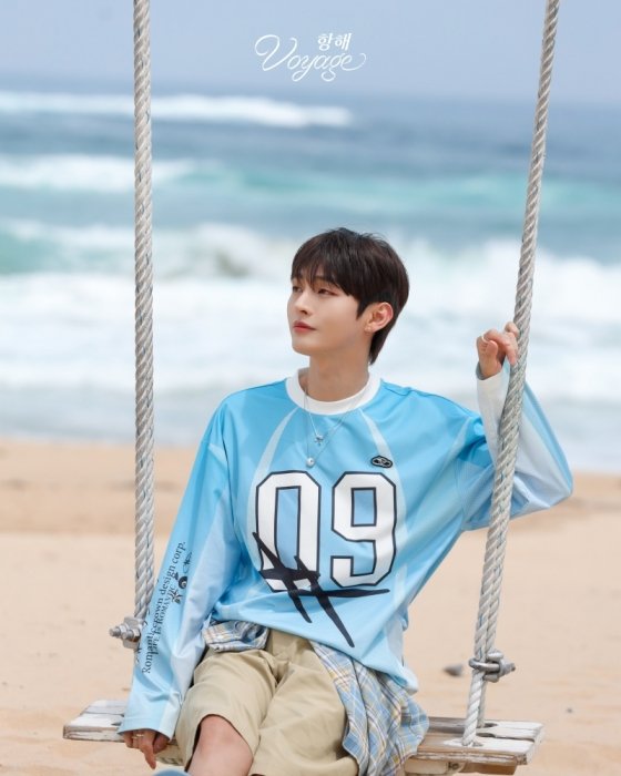 Yoon Jisung sits by the sea in 'Voyage' teaser image. Photo: Billions