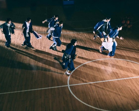 KickFlip group photo for 'Kick Out, Flip Now!' comeback, showing members in school gym uniforms. Photo courtesy of JYP Entertainment.